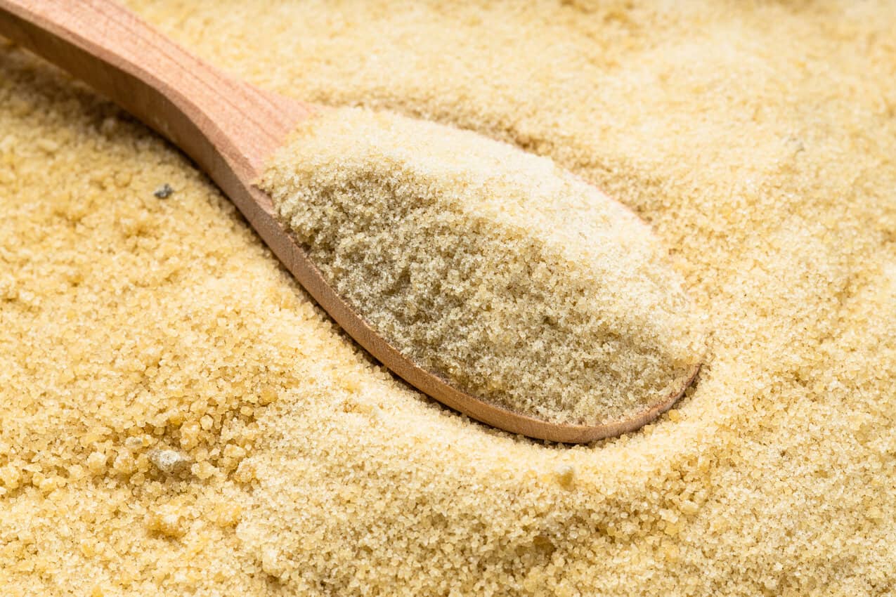 wooden spoon with granulated coconut sugar